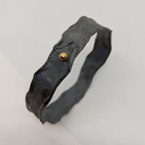 Oxidized Silver Bangle with Gold Ball by Barbara Adams at The Avenue Gallery, a contemporary fine art gallery in Victoria, BC, Canada.