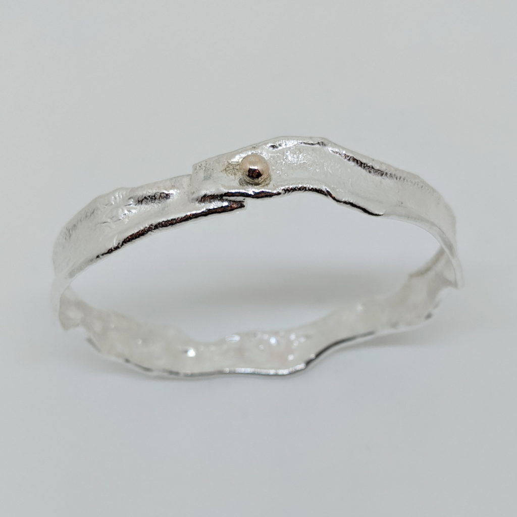 Narrow Reticulated Silver Bangle with Gold Ball by Barbara Adams at The Avenue Gallery, a contemporary fine art gallery in Victoria, BC, Canada.