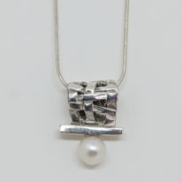 Woven Basket Necklace with White Pearl by Chi’s Creations at The Avenue Gallery, a contemporary fine art gallery in Victoria, BC, Canada.