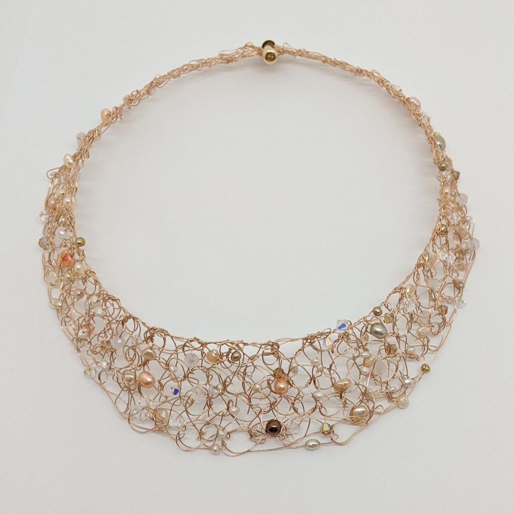 Gold-Fill Rose Gold Crochet Necklace with Freshwater Pearls & Swarovski Crystals by Veronica Stewart at The Avenue Gallery, a contemporary fine art gallery in Victoria, BC, Canada.