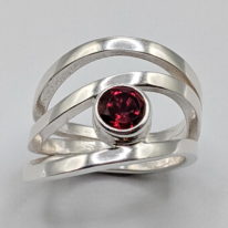 Wind Design Ring with Red Topaz by A & R Jewellery at The Avenue Gallery, a contemporary fine art gallery in Victoria, BC, Canada.