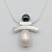 Balance Inukshuk Necklace with Hematite & White Pearl by Chi's Creations at The Avenue Gallery, a contemporary fine art gallery in Victoria, BC, Canada.