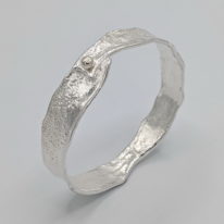 Narrow Reticulated Bangle with Gold Ball by Barbara Adams at The Avenue Gallery, a contemporary fine art gallery in Victoria, BC, Canada.