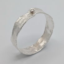 Medium Reticulated Bangle with Gold Ball by Barbara Adams at The Avenue Gallery, a contemporary fine art gallery in Victoria, BC, Canada.