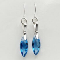 London Blue Topaz on a Buckle Earrings by A & R Jewellery at The Avenue Gallery, a contemporary fine art gallery in Victoria, BC, Canada.