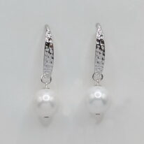 White Shell Pearl Earrings with Hammered Sterling Silver Wires by Val Nunns at The Avenue Gallery, a contemporary fine art gallery in Victoria, BC, Canada.