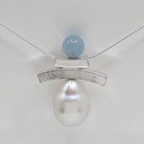 Balanced Inukshuk Necklace with Aquamarine & Pearl by Chi's Creations at The Avenue Gallery, a contemporary fine art gallery in Victoria, BC, Canada.
