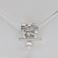 Woven Basket Necklace with White Pearl by Chi's Creations at The Avenue Gallery, a contemporary fine art gallery in Victoria, BC, Canada.