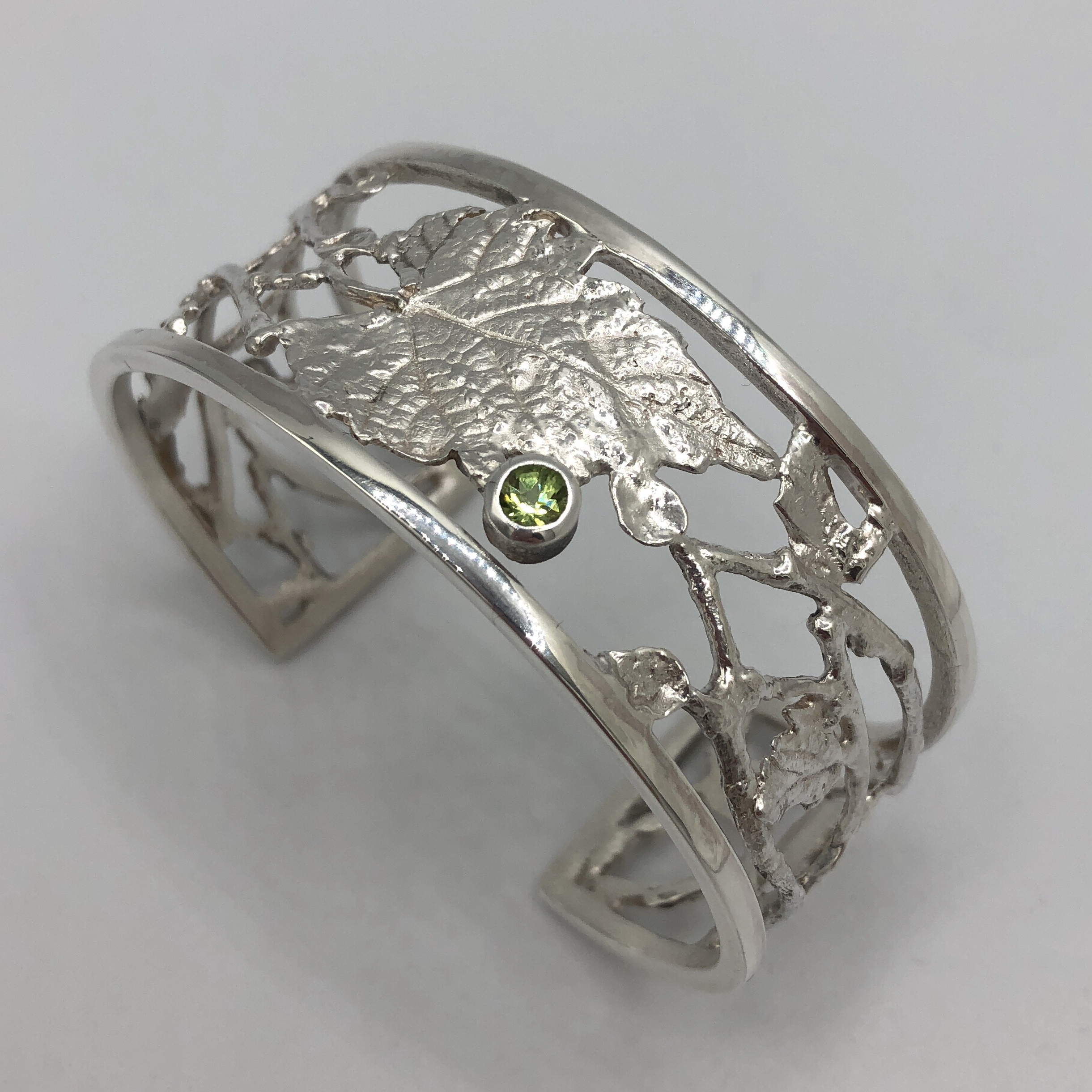 Tangled Garden Series Cuff with Peridot by Andrea Russell at The Avenue Gallery, a contemporary fine art gallery in Victoria, BC, Canada.