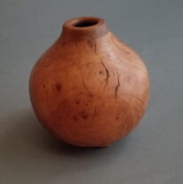 Arbutus Burl Hollow Form with Walnut Lip by Robert Wilman at The Avenue Gallery, a contemporary fine art gallery in Victoria, BC, Canada.