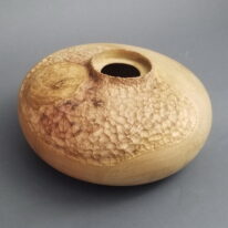 Textured Hollow Form in Red Oak by Robert Wilman at The Avenue Gallery, a contemporary fine art gallery in Victoria, BC, Canada.