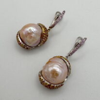 Pale Peach Pearl Earrings with Sapphires by Val Nunns at The Avenue Gallery, a contemporary fine art gallery in Victoria, BC, Canada.
