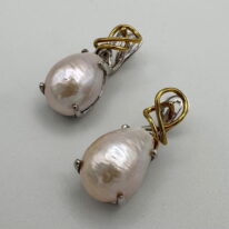 White Pearl Earrings with Metal Detail by Val Nunns at The Avenue Gallery, a contemporary fine art gallery in Victoria, BC, Canada.