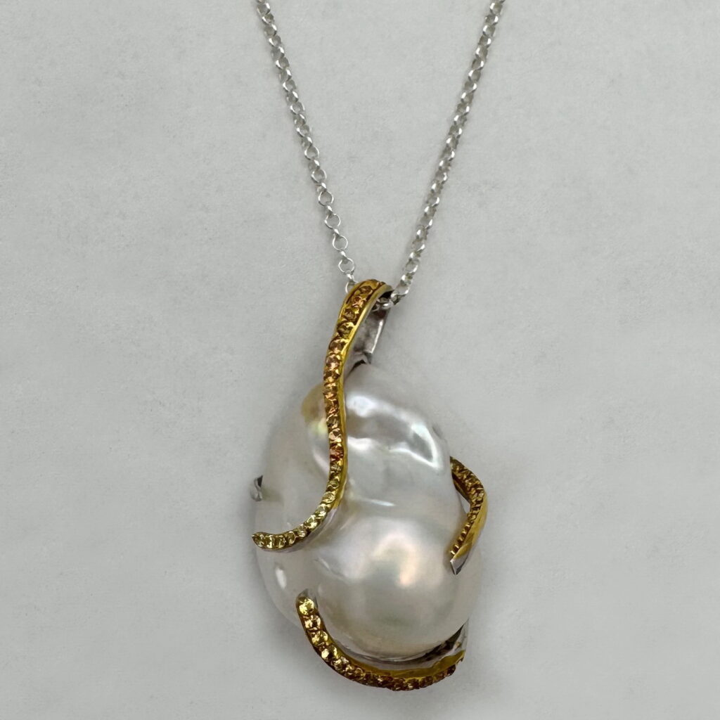 Baroque Pearl & Sapphire Pendant by Val Nunns at The Avenue Gallery, a contemporary fine art gallery in Victoria, BC, Canada.