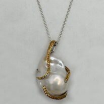Baroque Pearl & Sapphire Pendant by Val Nunns at The Avenue Gallery, a contemporary fine art gallery in Victoria, BC, Canada.