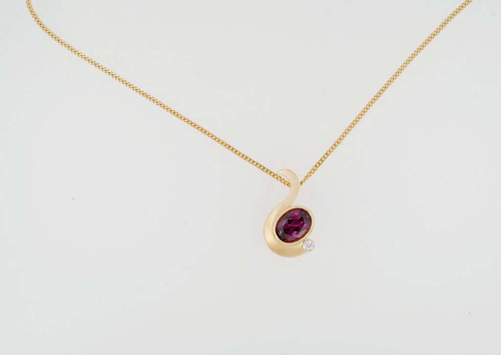 Rhodolite Garnet & Diamond Pendant by Bayot Heer at The Avenue Gallery, a contemporary fine art gallery in Victoria, BC, Canada.