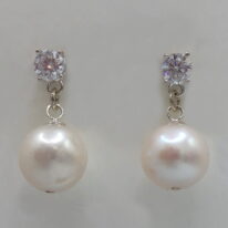 White Round Pearl & Lab Grown Diamond Earrings by Val Nunns at The Avenue Gallery, a contemporary fine art gallery in Victoria, BC, Canada.