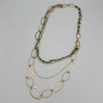 Gold-Fill Multi-strand Necklace with Emerald Chips & Green Crystals by Veronica Stewart at The Avenue Gallery, a contemporary fine art gallery in Victoria, BC, Canada.