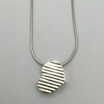 Slanted Heart Pendant by MichaudMichaud Design at The Avenue Gallery, a contemporary fine art gallery in Victoria, BC, Canada.