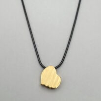 Slanted Heart Pendant by MichaudMichaud Design at The Avenue Gallery, a contemporary fine art gallery in Victoria, BC, Canada.