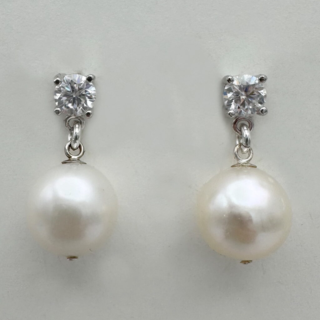 White Pearl & Lab Grown Diamond Earrings by Val Nunns at The Avenue Gallery, a contemporary fine art gallery in Victoria, BC, Canada.