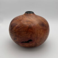 Arbutus Burl Hollow Form by Robert Wilman at The Avenue Gallery, a contemporary fine art gallery in Victoria, BC, Canada.