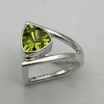 D-Book Band Ring with Peridot by A & R Jewellery at The Avenue Gallery, a contemporary fine art gallery in Victoria, BC, Canada.