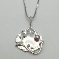 Lily Pad Pendant with Pink Pearl by A & R Jewellery at The Avenue Gallery, a contemporary fine art gallery in Victoria, BC, Canada.