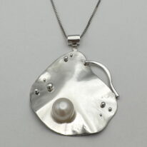 Lily Pad Pendant with Pearl by A & R Jewellery at The Avenue Gallery, a contemporary fine art gallery in Victoria, BC, Canada.