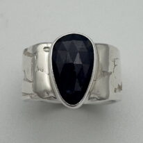 River Band Ring with Sapphire by A & R Jewellery at The Avenue Gallery, a contemporary fine art gallery in Victoria, BC, Canada.