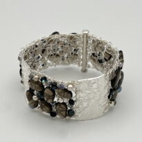 Crocheted Fine Silver Wire Cuff with Textured Bars and Smoky Quartz, Swarovski Crystals and Pearls by Veronica Stewart at The Avenue Gallery, a contemporary fine art gallery in Victoria, BC, Canada.