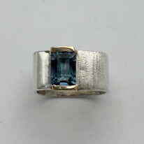 Large Square Channel Set Ring with Blue Topaz by Chi's Creations at The Avenue Gallery, a contemporary fine art gallery in Victoria, BC, Canada.