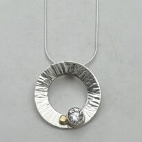 Hammered Small Wreath Pendant with Cubic Zirconia & 18kt. Gold by Chi's Creations at The Avenue Gallery, a contemporary fine art gallery in Victoria, BC, Canada.