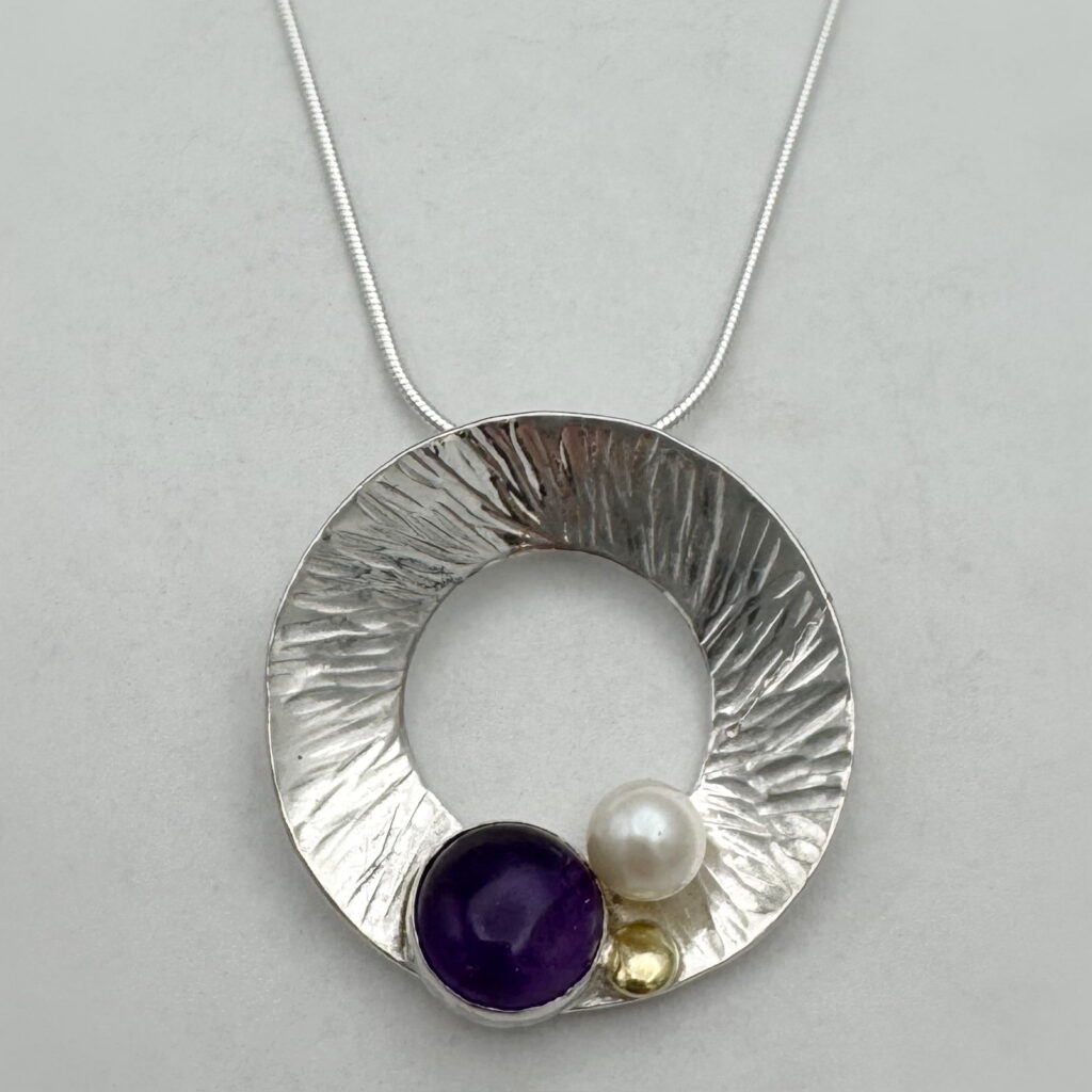 Hammered Wreath Pendant with Amethyst & 18kt. Gold by Chi's Creations at The Avenue Gallery, a contemporary fine art gallery in Victoria, BC, Canada.