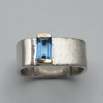Medium Square Channel Set Ring with Blue Topaz by Chi's Creations at The Avenue Gallery, a contemporary fine art gallery in Victoria, BC, Canada.