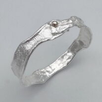 Reticulated Silver Bangle with Gold Ball by Barbara Adams at The Avenue Gallery, a contemporary fine art gallery in Victoria, BC, Canada.