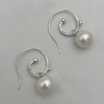 White Freshwater Pearl & Sterling Silver Curly Wire Earrings by Val Nunns at The Avenue Gallery, a contemporary fine art gallery in Victoria, BC, Canada.