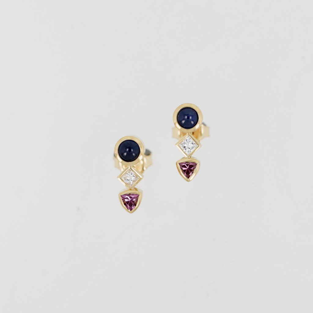 Blue Sapphire, Diamond & Garnet Earrings by Bayot Heer at The Avenue Gallery, a contemporary fine art gallery in Victoria, BC, Canada.