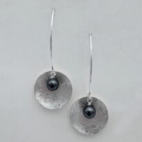 Scribbled Shell Disc Earrings with Hematite by Chi's Creations at The Avenue Gallery, a contemporary fine art gallery in Victoria, BC, Canada.
