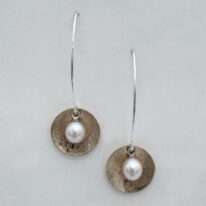 Balanced Scribbled Concaved Gold-Filled Disc Earrings with White Pearls by Chi’s Creations at The Avenue Gallery, a contemporary fine art gallery in Victoria, BC, Canada.