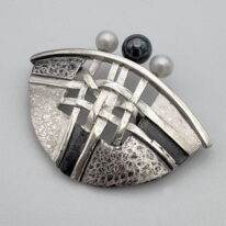Woven Half Moon Pin by Chi’s Creations at The Avenue Gallery, a contemporary fine art gallery in Victoria, BC, Canada.