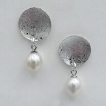 Balanced Scribbled Disc Dangle Earrings with White Pearls by Chi’s Creations at The Avenue Gallery, a contemporary fine art gallery in Victoria, BC, Canada.