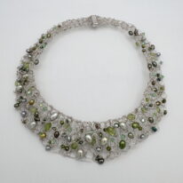 Fine Silver Knitted Collar with Green Freshwater Pearls, Peridot & Swarovski Crystals by Veronica Stewart at The Avenue Gallery, a contemporary fine art gallery in Victoria, BC, Canada.