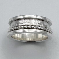 Finished Edge Spinner Ring by A & R Jewellery at The Avenue Gallery, a contemporary fine art gallery in Victoria, BC, Canada.