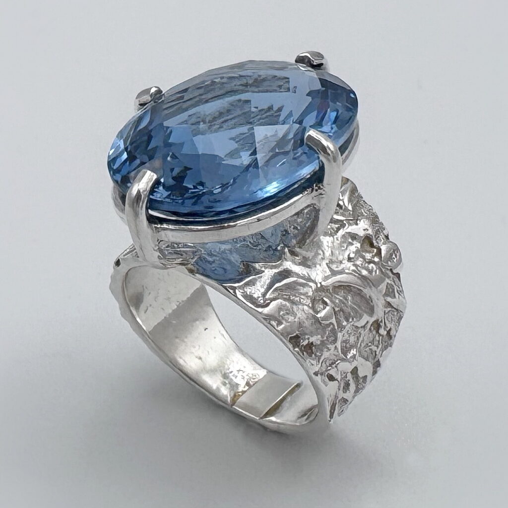 Lunar Band Ring with London Blue Topaz by A & R Jewellery at The Avenue Gallery, a contemporary fine art gallery in Victoria, BC, Canada.