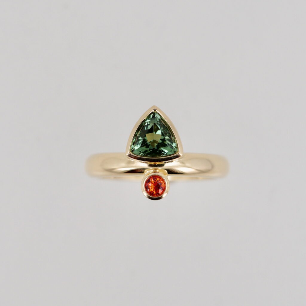 Green Tourmaline & Orange Sapphire Ring by Bayot Heer at The Avenue Gallery, a contemporary fine art gallery in Victoria, BC, Canada.