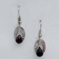 Small Textured Oval Fine Silver Earrings with Garnets by Veronica Stewart at The Avenue Gallery, a contemporary fine art gallery in Victoria, BC, Canada.